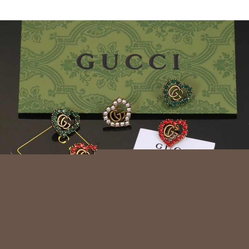 G*u*i earrings